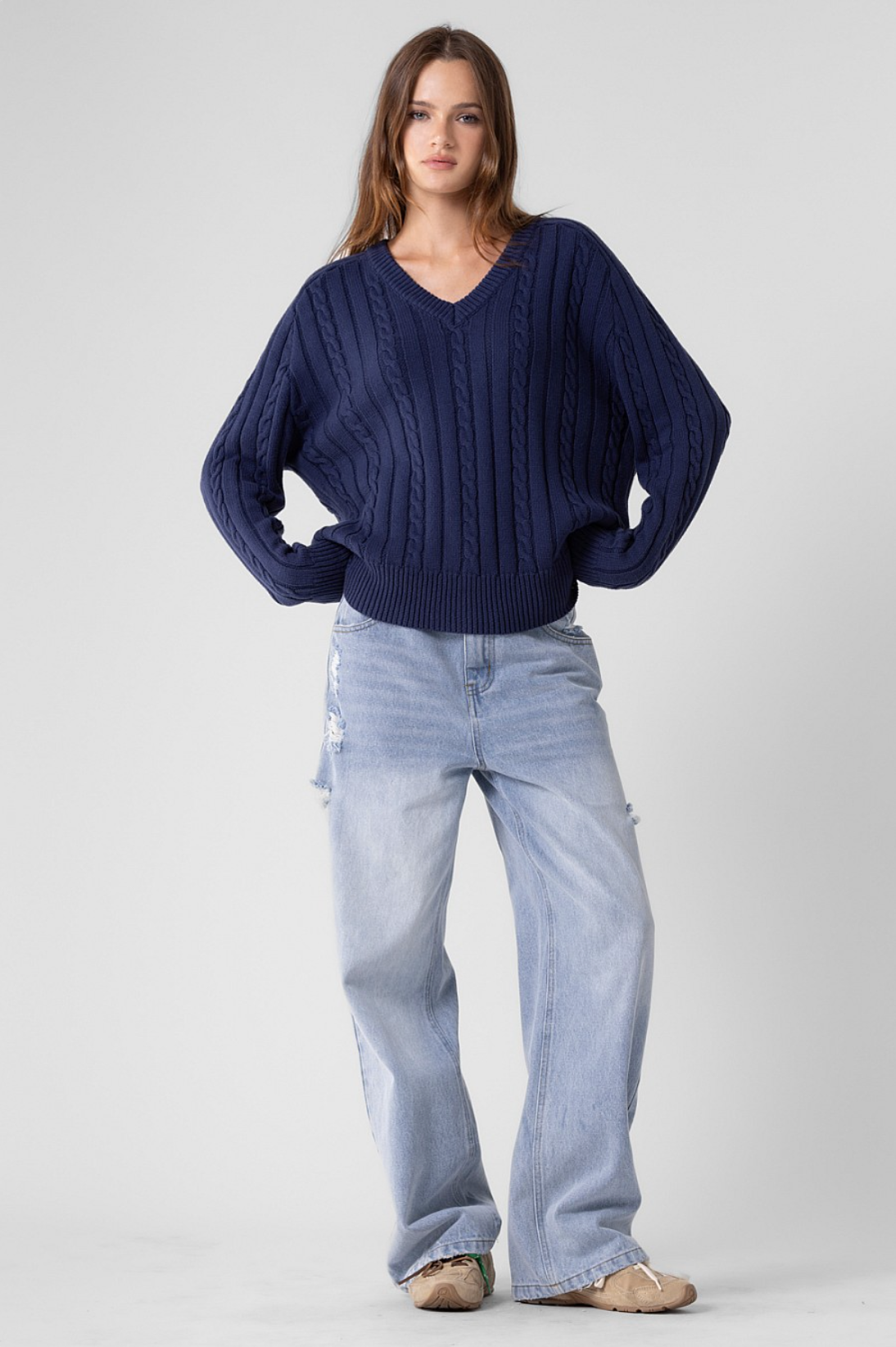 Girl wearing blue knit sweater