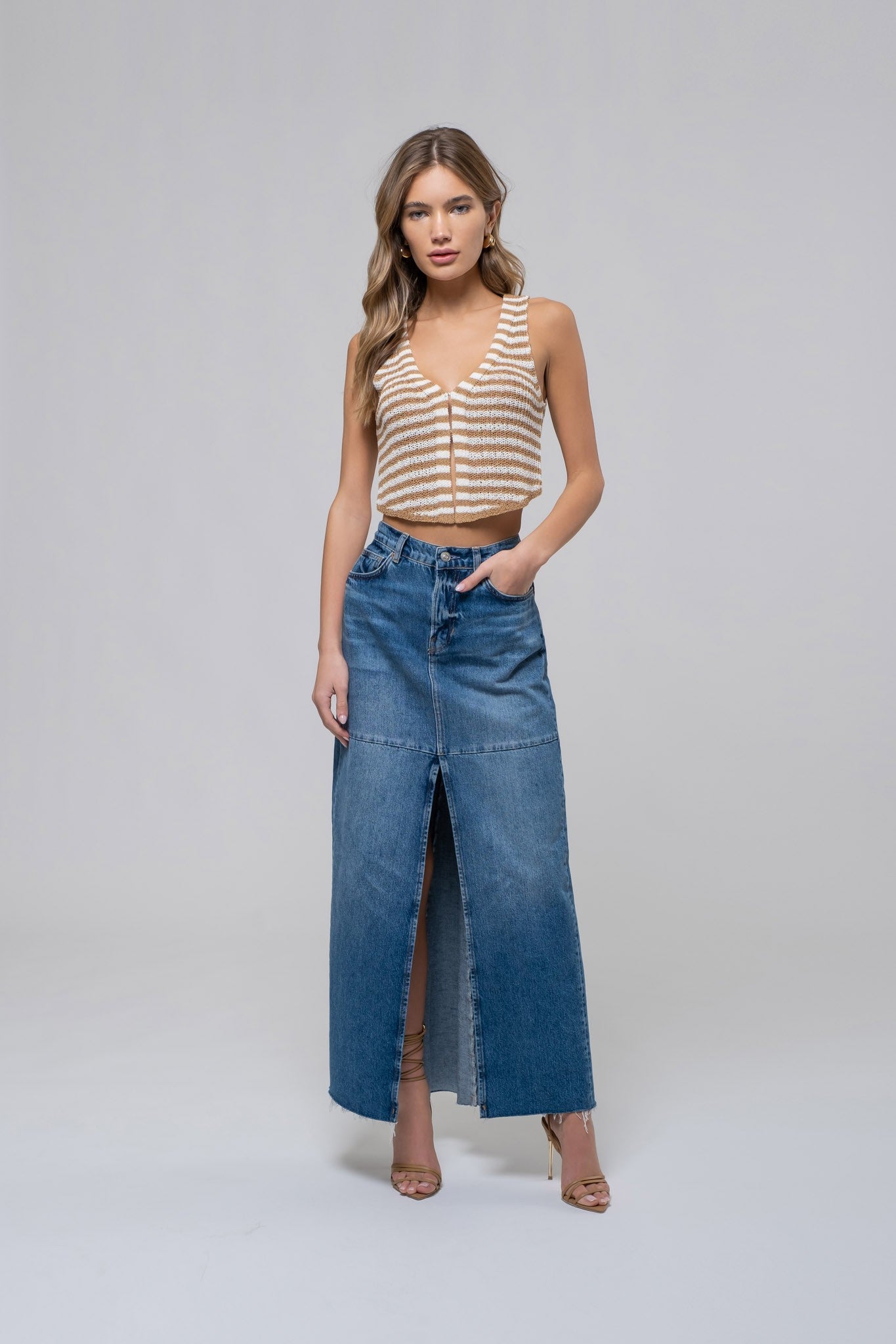 Girl wearing white and tan striped crop top