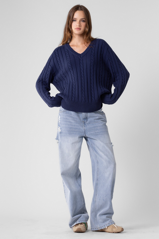 Girl wearing blue knit sweater
