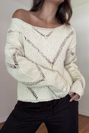 Girl wearing cream sweater