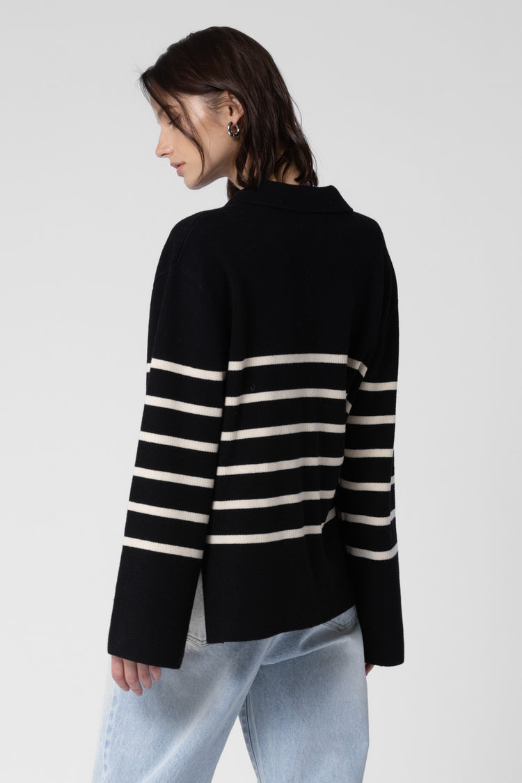 Girl wearing cute black striped sweater 