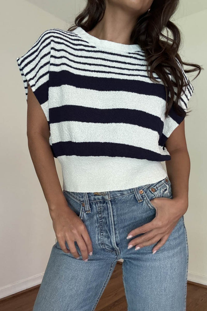 Girl wearing cute blue and white striped shirt