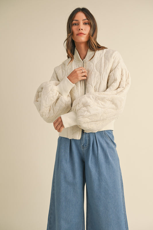 Girl wearing cute cream puffer