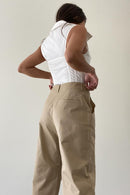 Girl wearing cute tan trousers