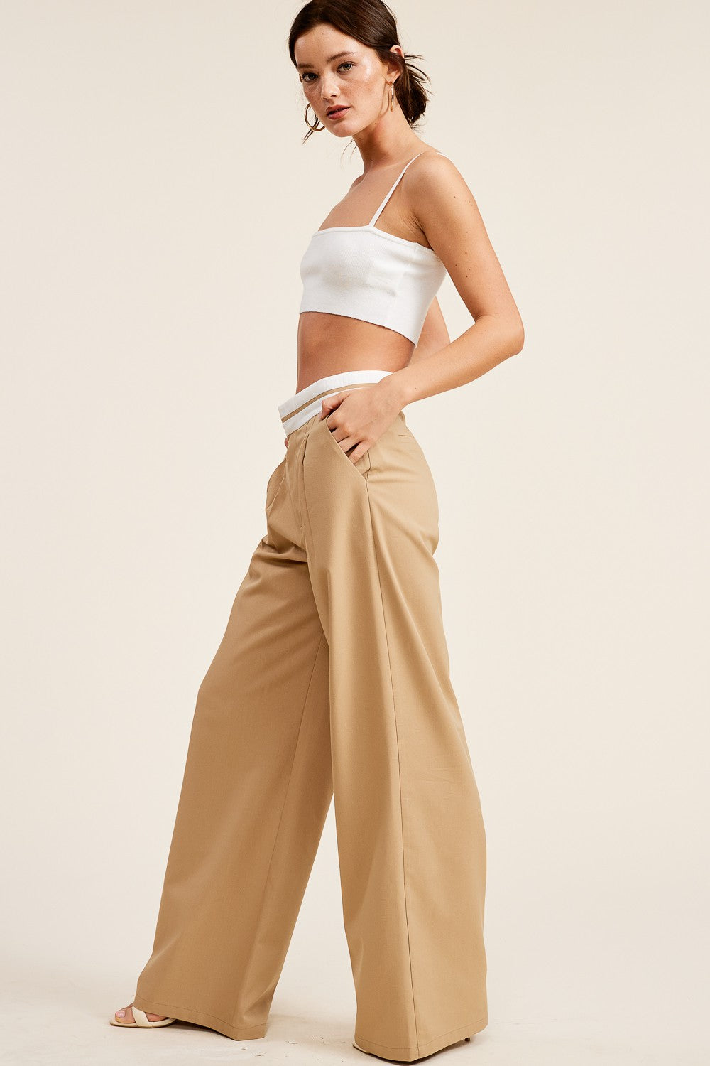 Girl wearing tan trousers