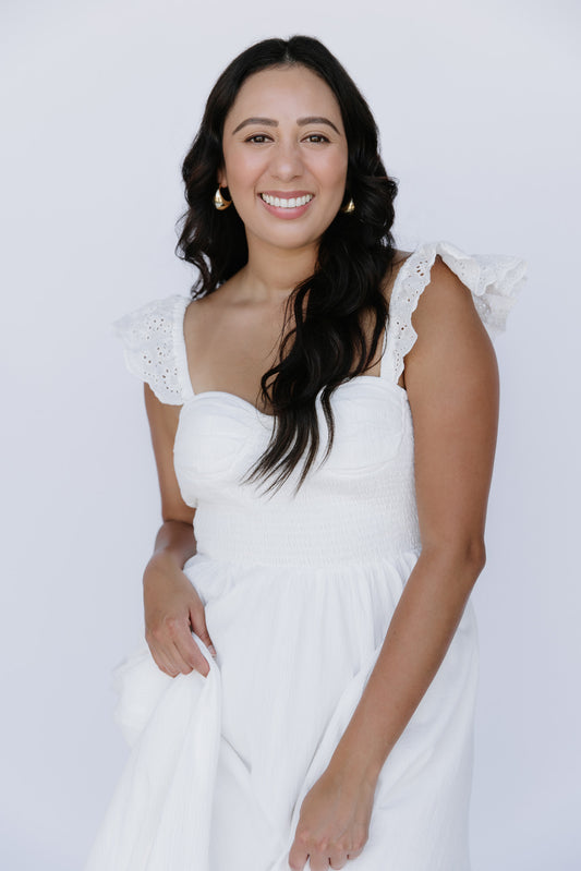 Girl wearing viral white flowy dress